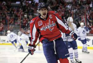 Washington Capitals left wing Alex Ovechkin (8), from Russia, celebrates his goal in the first period of an NHL hockey game against the Toronto Maple Leafs, Sunday, March 1, 2015, in Washington. (AP Photo/Alex Brandon)